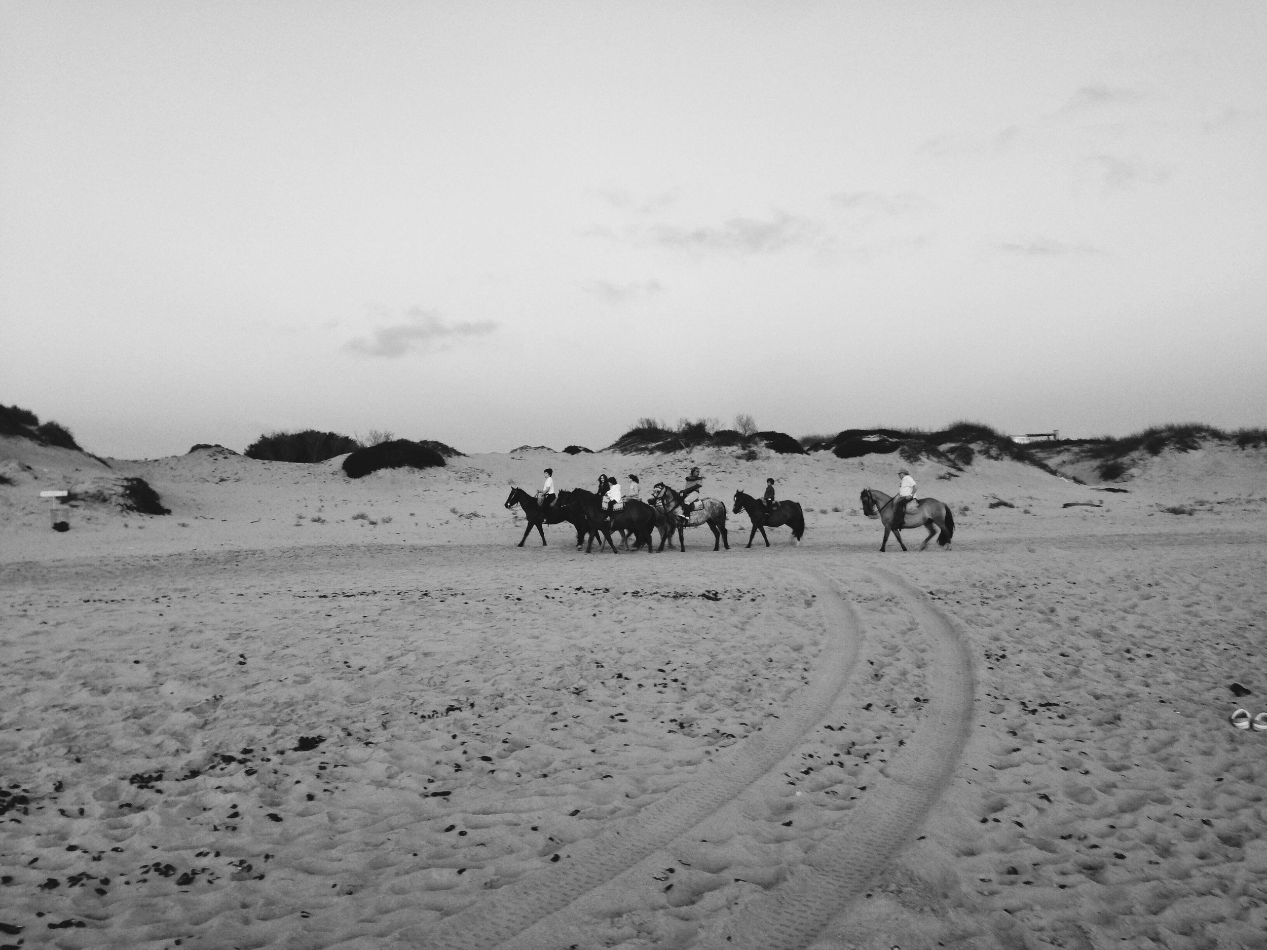 Riders at dusk on Playa Mansa