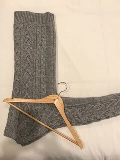 - Fold your sweater in half long ways - Position hanger hook in the arm pit area of the sweater