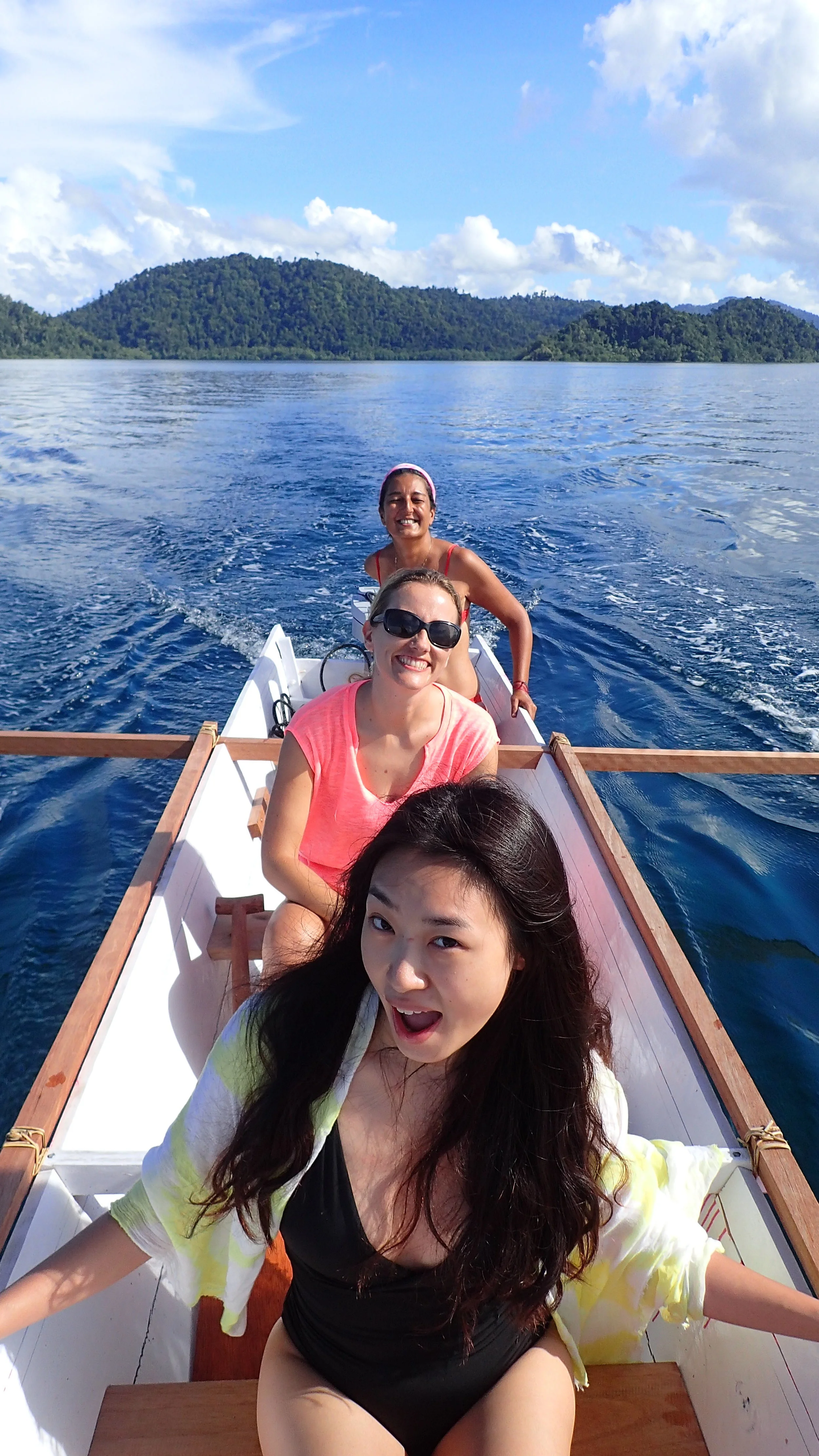 Guests enjoying the sun canoeing in Raja Ampat - MahaRaja Eco Dive Lodge