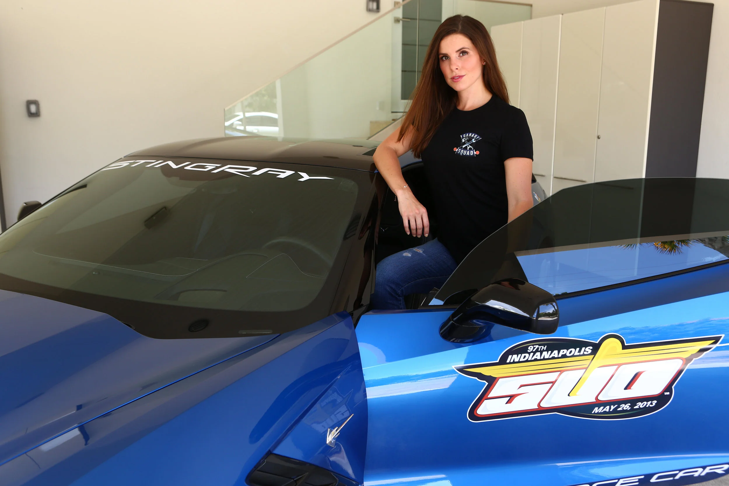 #SkinBabe Lauren Kanaan standing next to Tony Kanaan's pace car. 