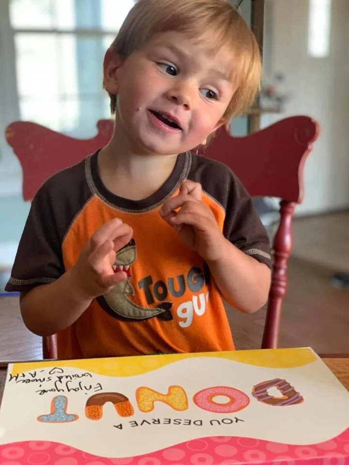 Luca Eating Donuts.JPG