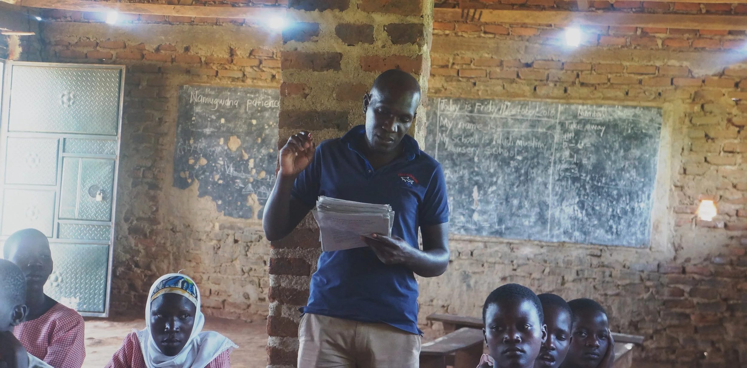 Mr Babaki , explaining the debate rules to P5 class: Idudi Muslim Primary School