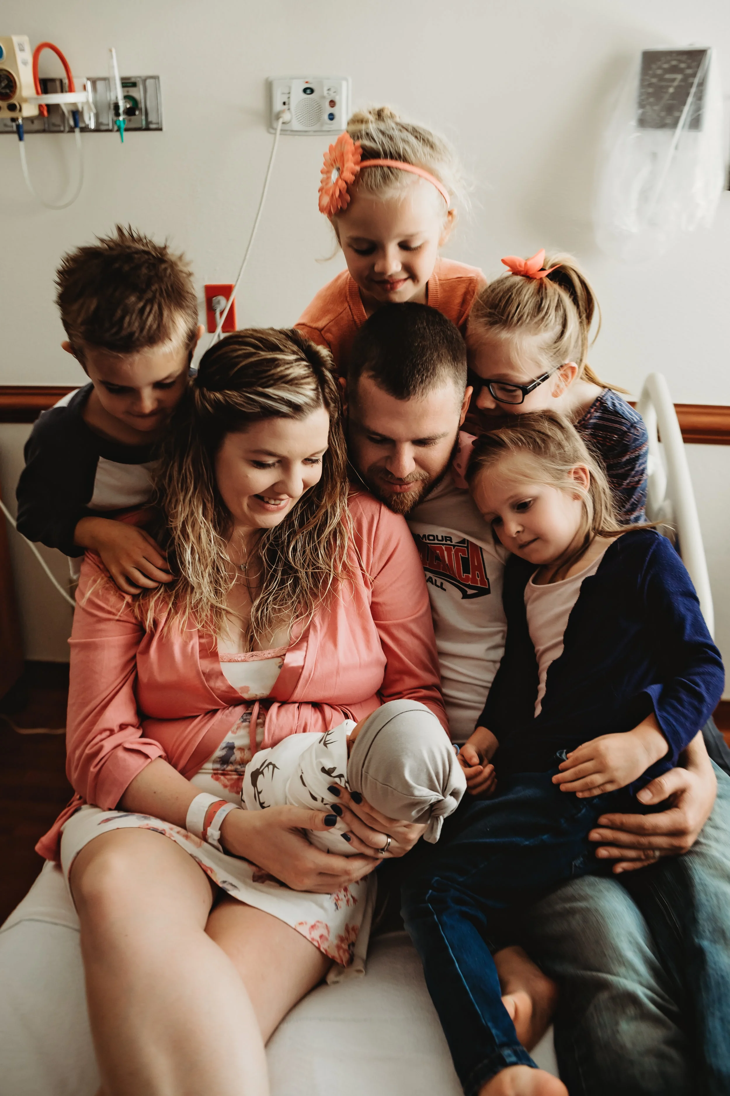 That smile. Knowing her whole family is right here, all five kiddos, & her husband. For this moment the world is calm.