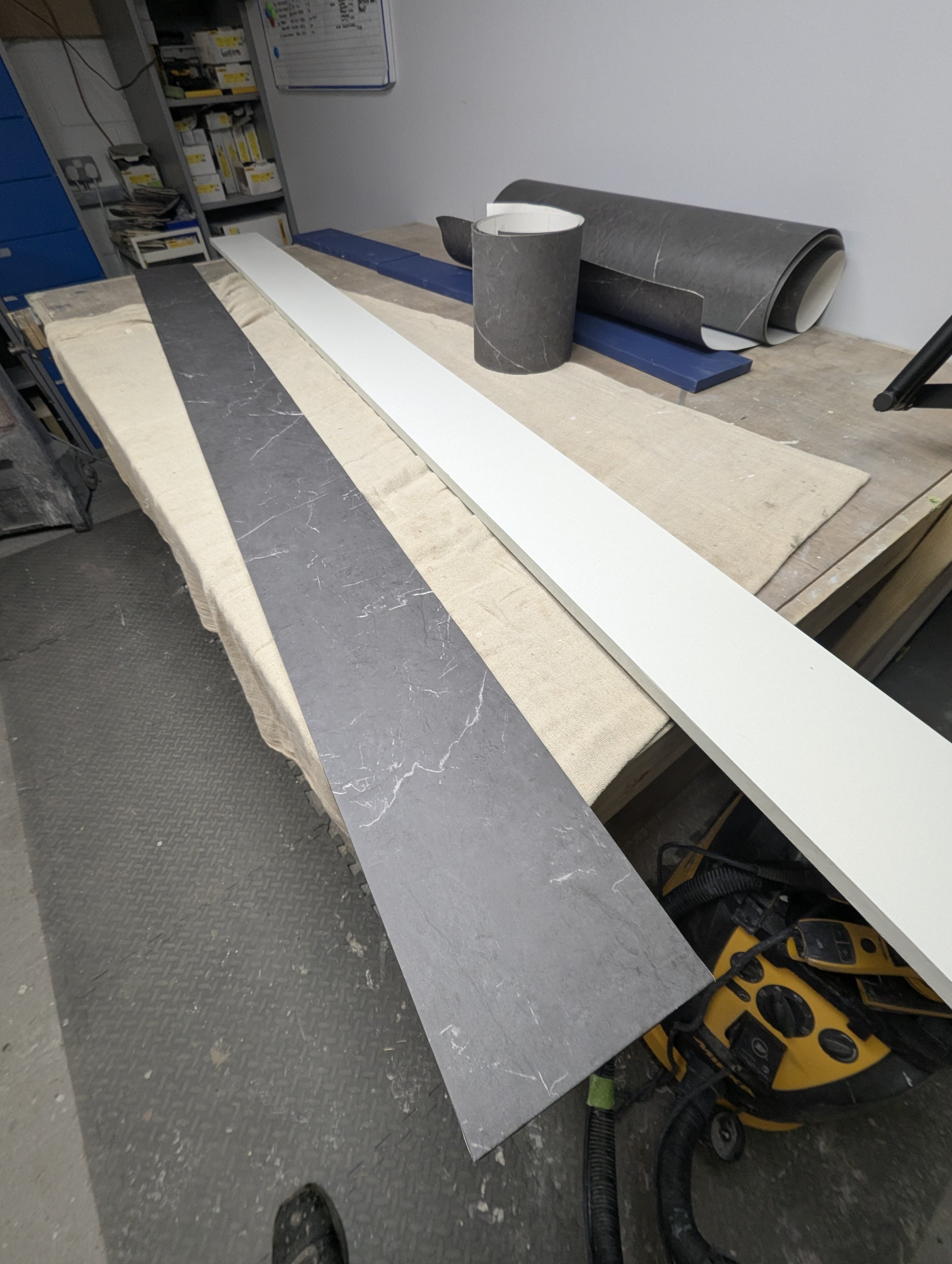 kitchen plinths primed mdf wrapped.jpg