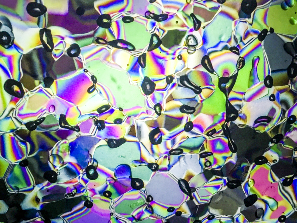 A thin section of glacier ice placed between two crossed polarizers.
