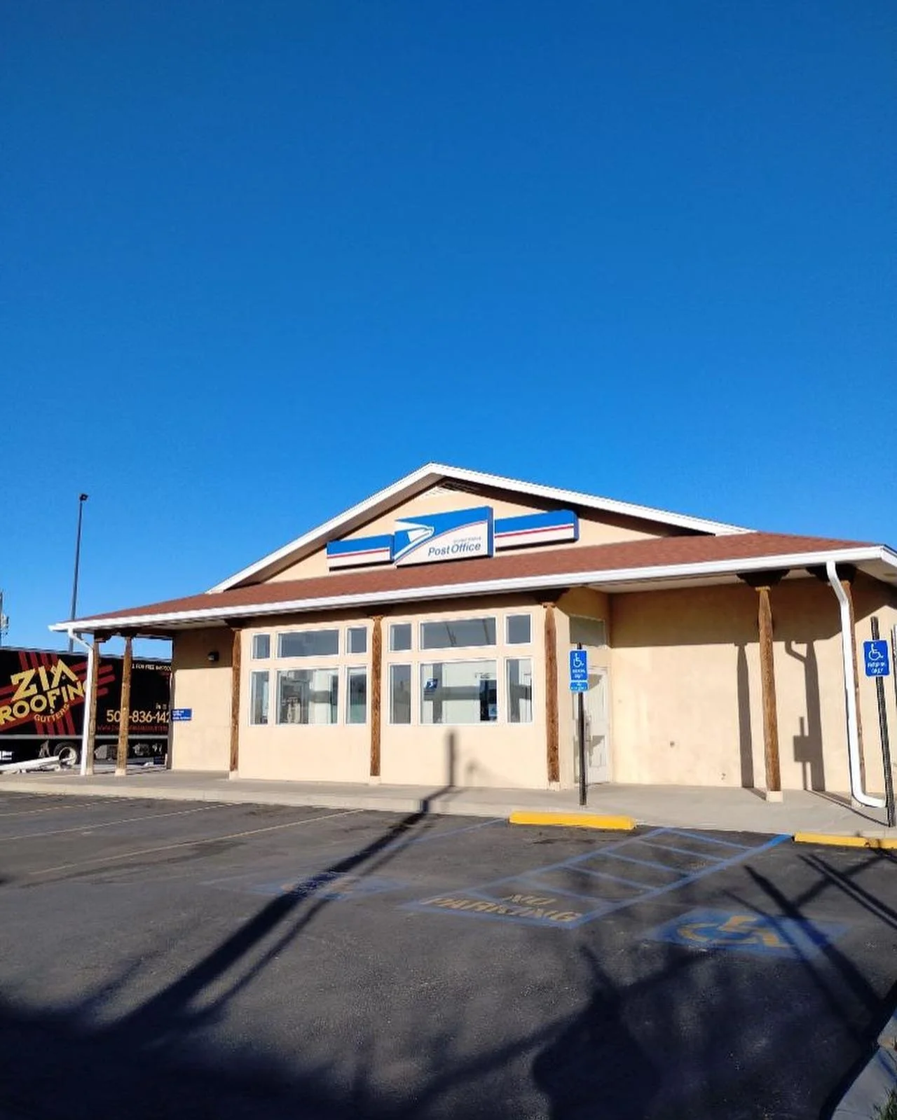 195 LF of seamless gutters beautifully installed on the Postal Office in Bernalillo.
