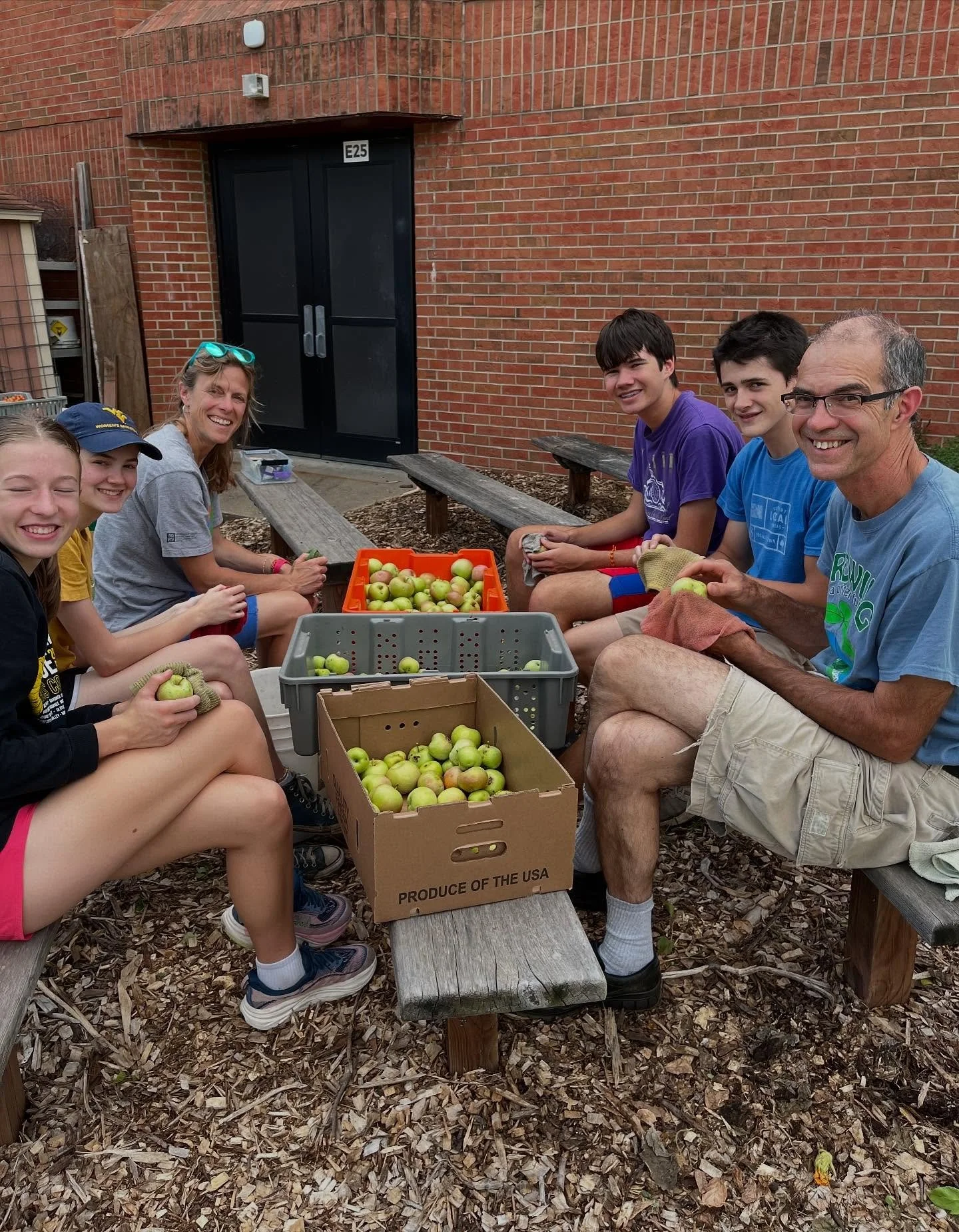 The Sunday evening crew sorting and cleaning our orchard apples to take to market this Wednesday.