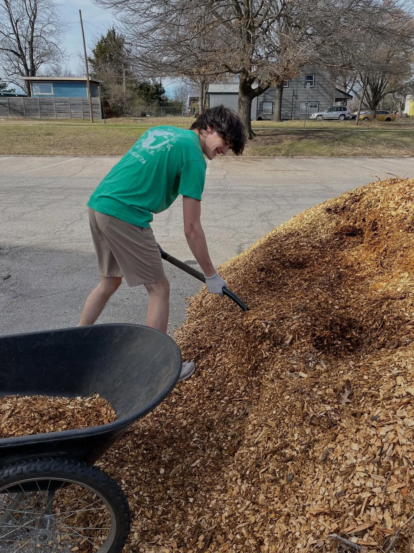 Starting to flex our mulch moving muscles. Thanks to our friends at Kansas Tree Care for the generous pile of mulch.
