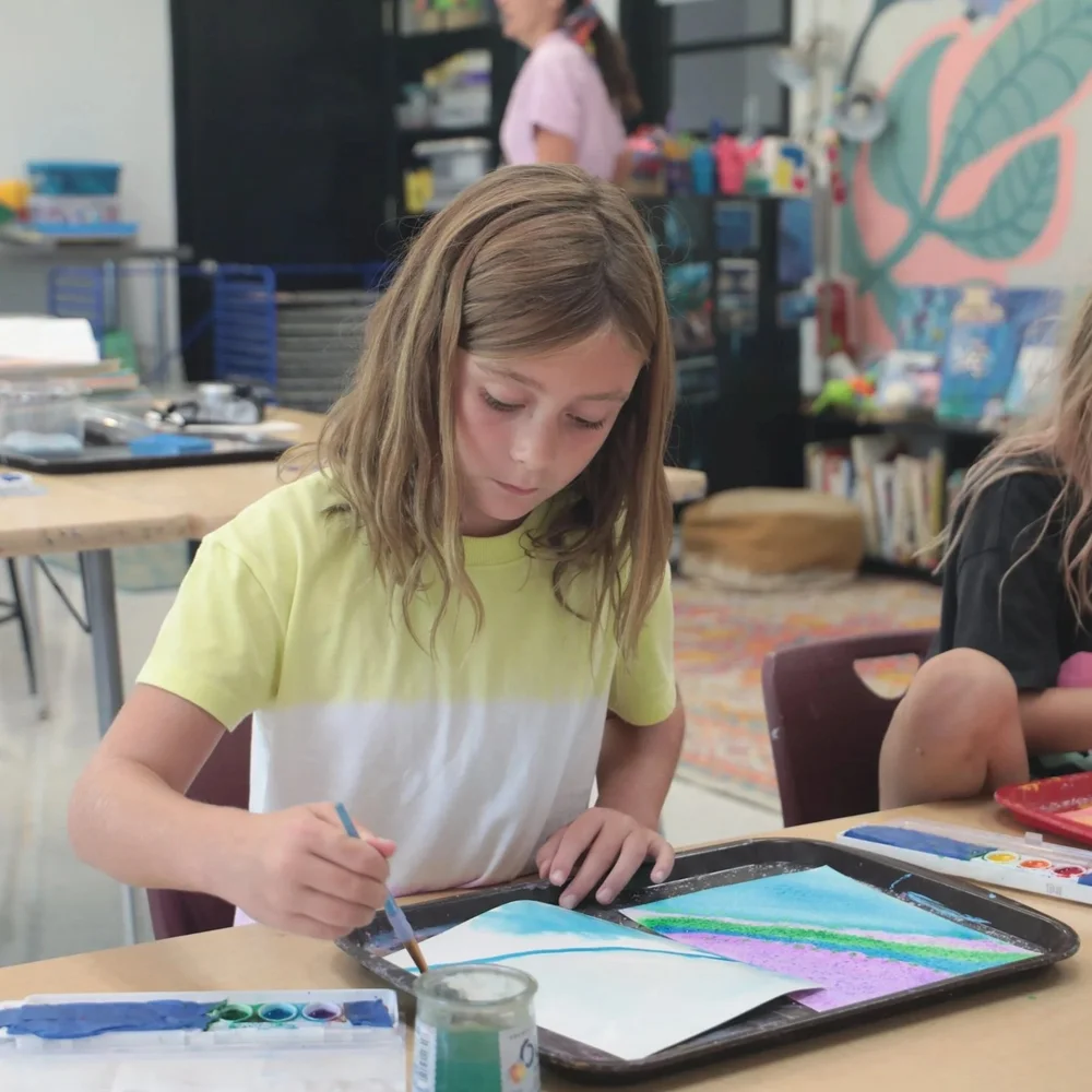 Camper painting a colorful watercolor picture