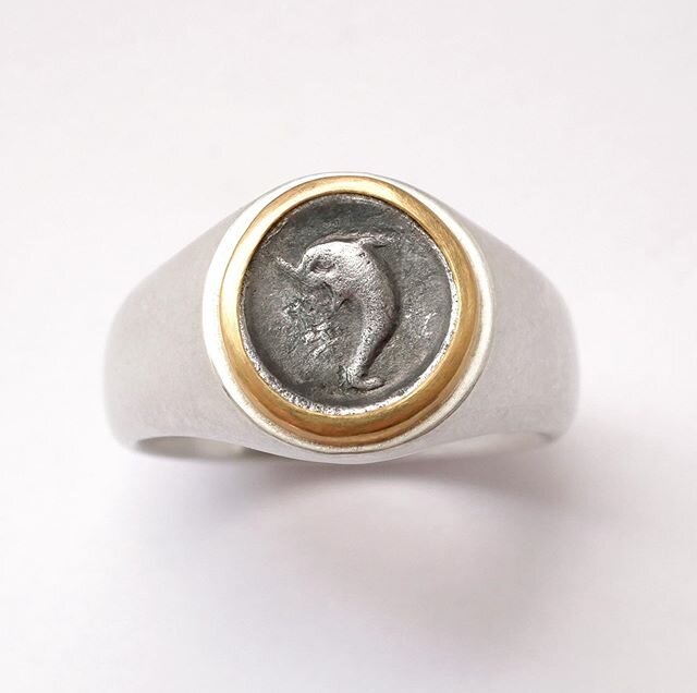Ancient Greek silver coin from Calabria - 4th century B.C.- set in a silver and gold ring. #coinjewelry #greekcoins #ancientcoins #dolfin #silvercoin #ancientart