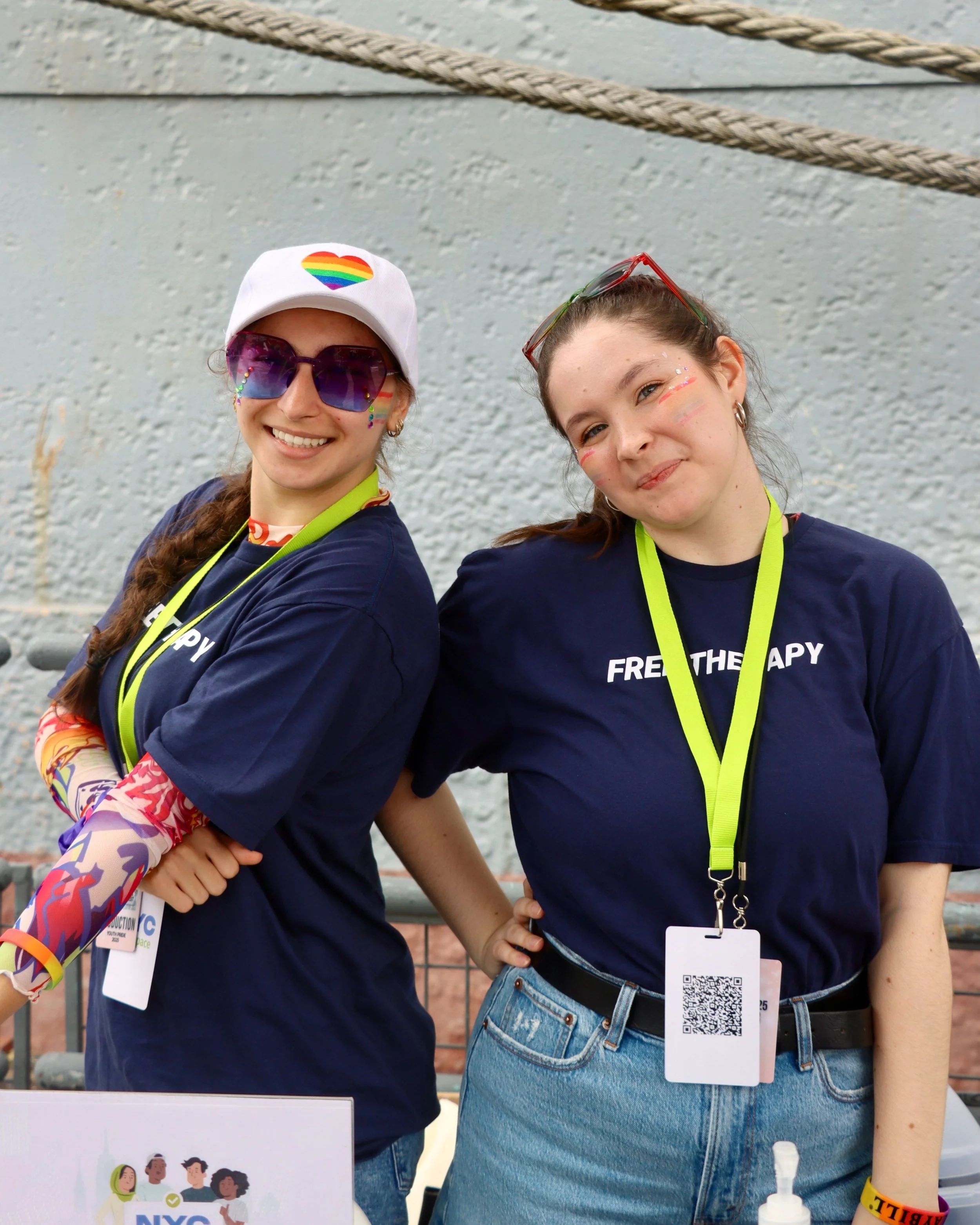 theatreMAMA ambassadors at NYC high school lunchroom table, sharing free Talkspace therapy info with teens