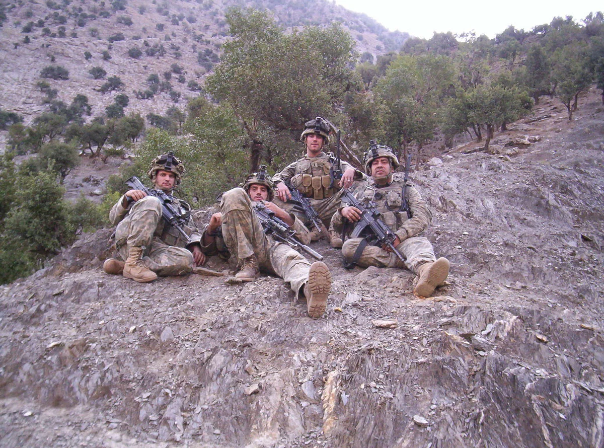 mcpadden, dole, langmesser, and gallegos taking a breather after a firefight in the korengal.jpg