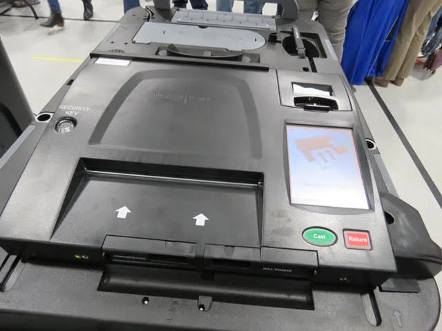 10. The arrows show you where to insert your ballot.