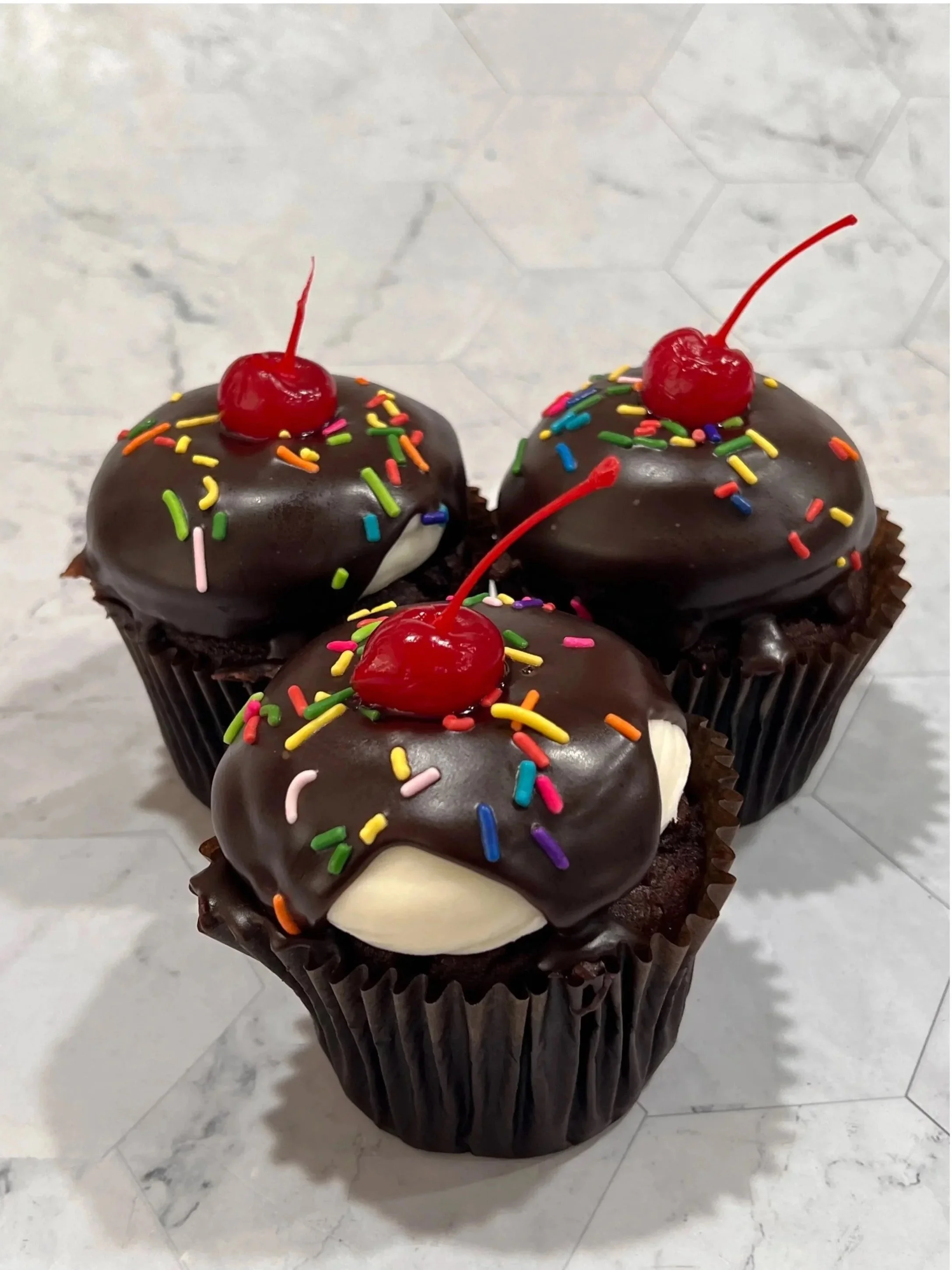 HOT FUDGE- chocolate cake filled with fudge. topped with buttercream and ganache
