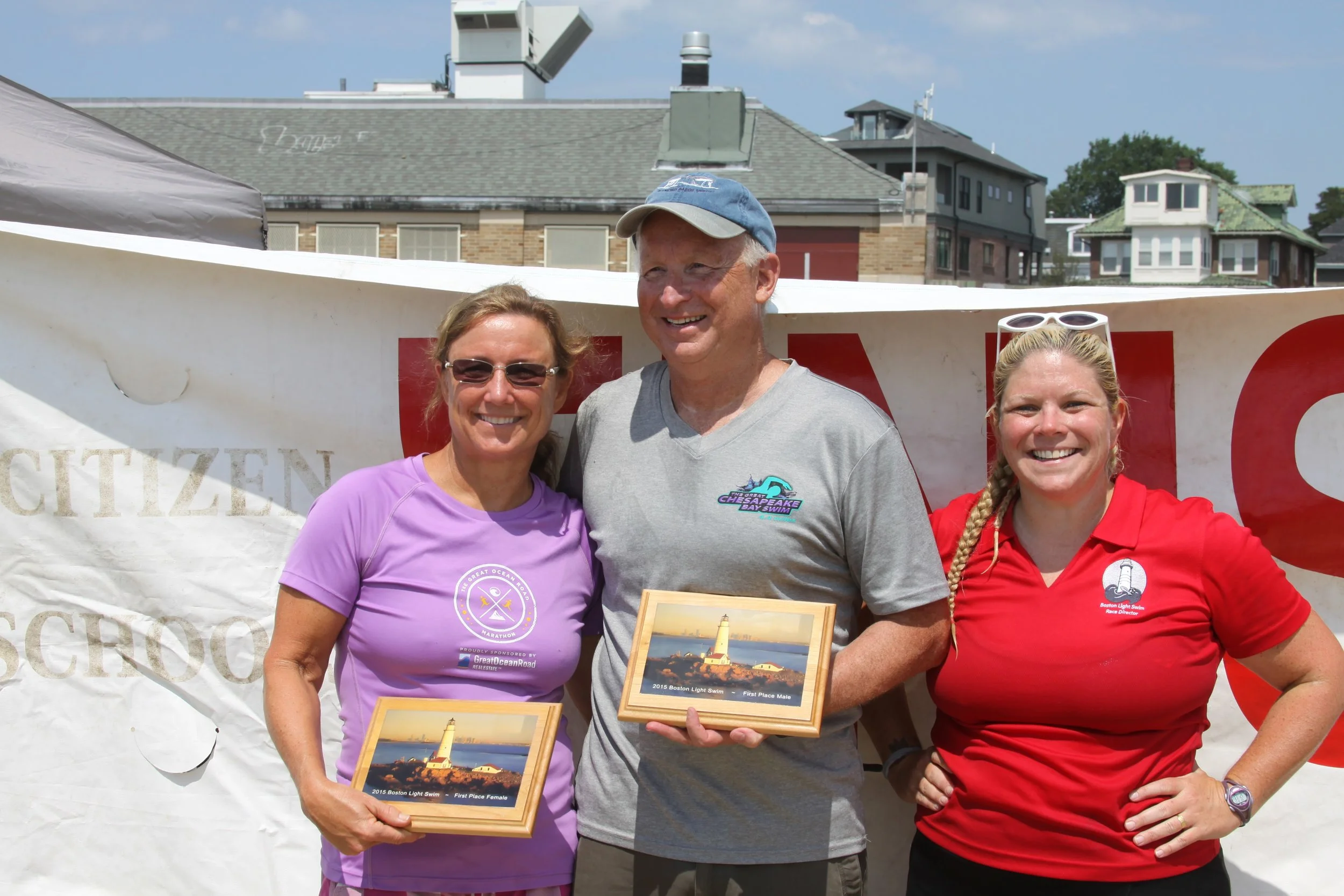 Penny Palfrey and Jim Clifford, first and second place finishers of the 2015 Boston Light Swim, with Race Co-Director, Elaine Howley