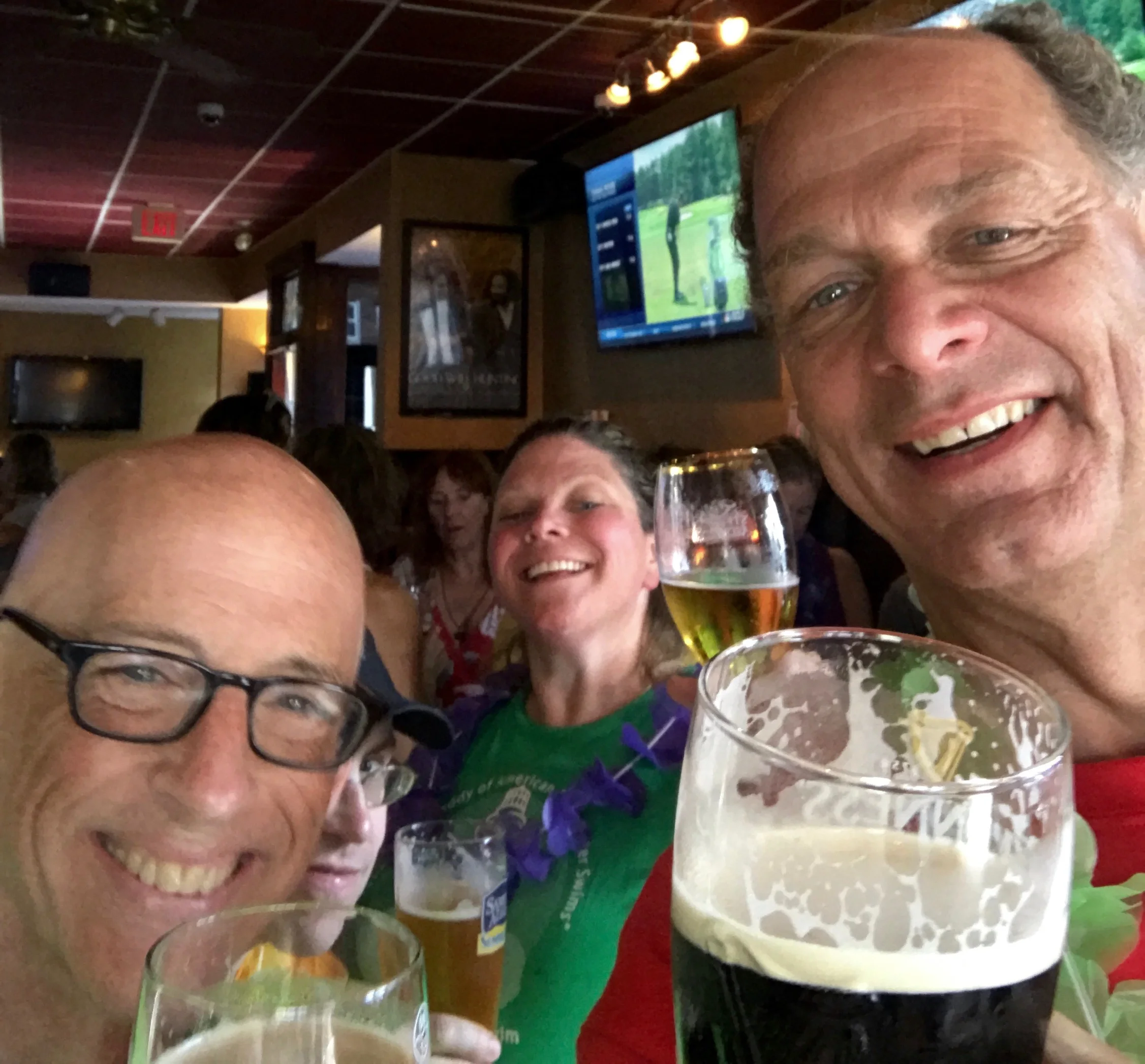 Jef Mallett, Mark Howley, Elaine Howley, and Bill Shipp celebrate the completion of another wonderful Boston Light Swim at the L Street Tavern after the 2017 race.