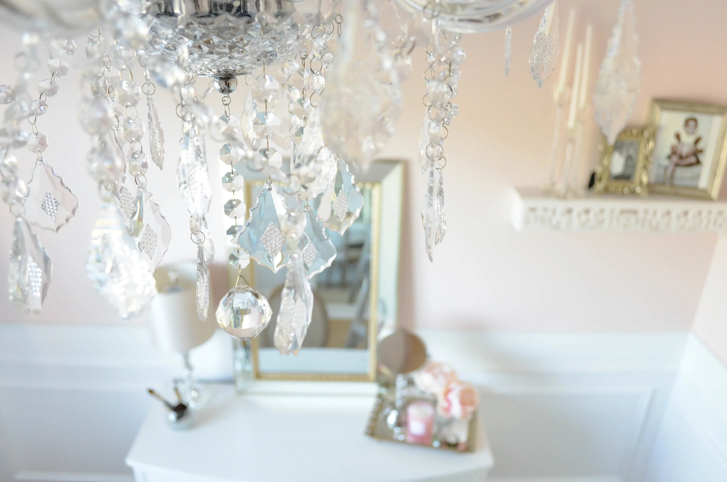 Sherwin Williams Intimate White (SW 6322). This elegant Parisian inspired Beauty Room is the perfect retreat for the lady of the house to escape with a glass of wine or a pot of tea. The impeccable white wainscoting compliments the soft pink walls and Parisian style decor. A perfectly placed white vanity makeup table adorned with a soft gold beveled mirror is the perfect place to apply those finishing touches for a night out on the town!