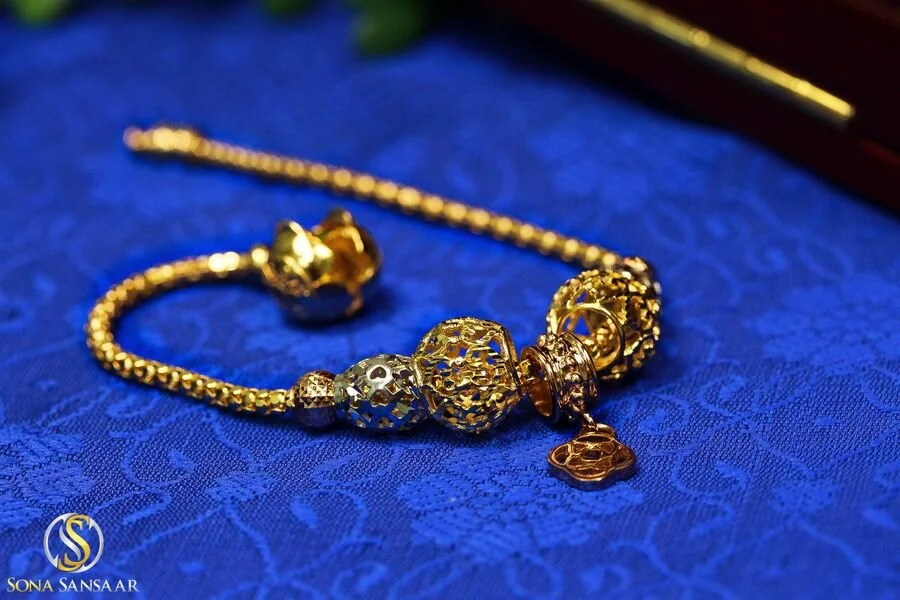 18kt Charm Bracelet 1_LREdited_Watermarked_result.jpg