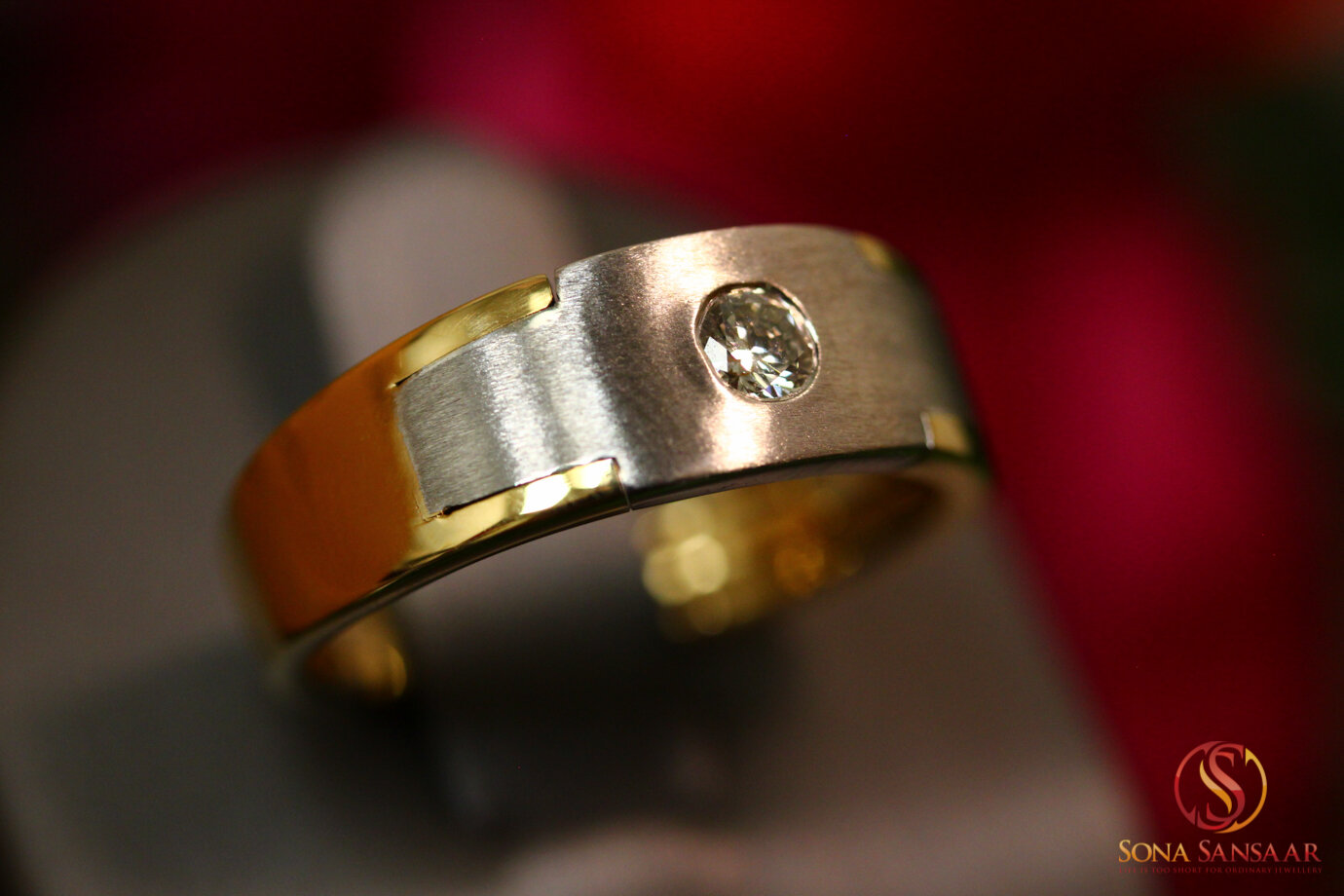 White and Yellow Gold Band with a Flush Solitaire Stone