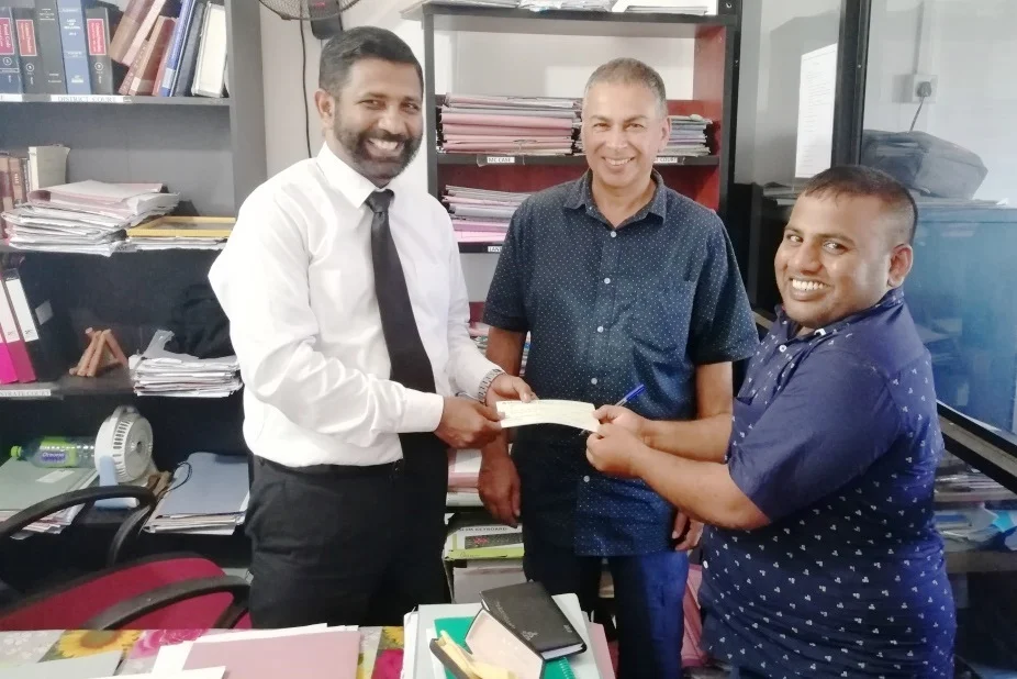 Handing over the chq 2.jpg