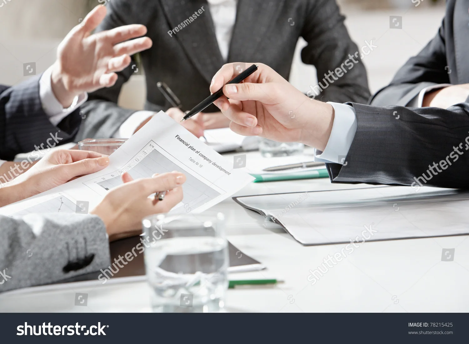stock-photo-vertical-image-of-human-hands-during-business-discussion-78215425.jpg