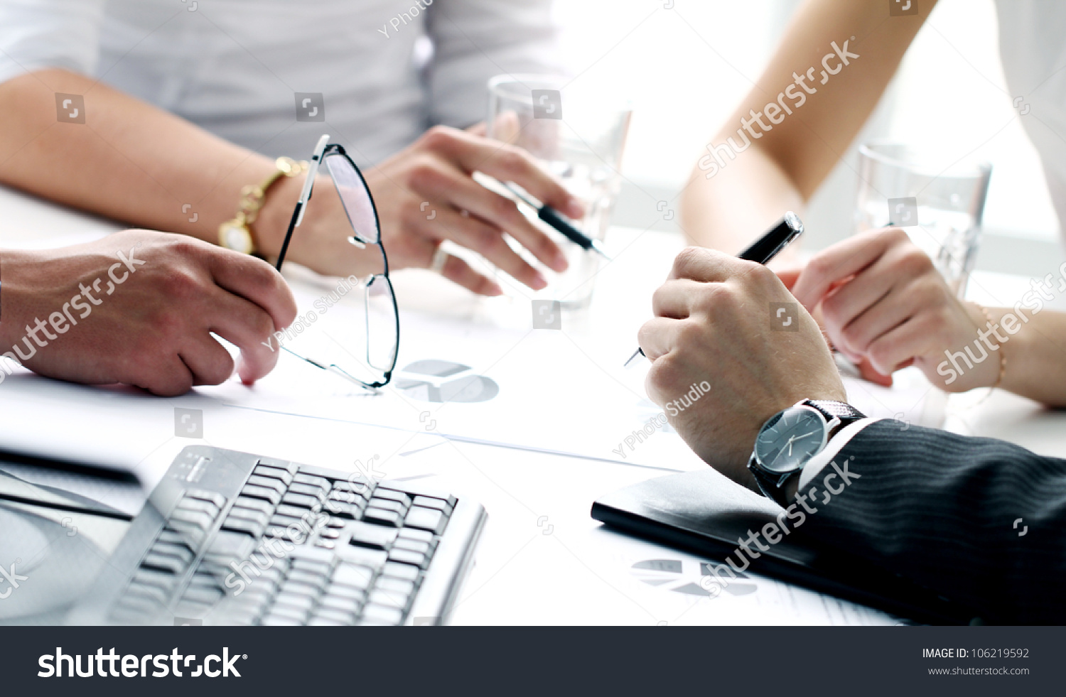stock-photo-close-up-of-working-process-at-business-meeting-106219592.jpg