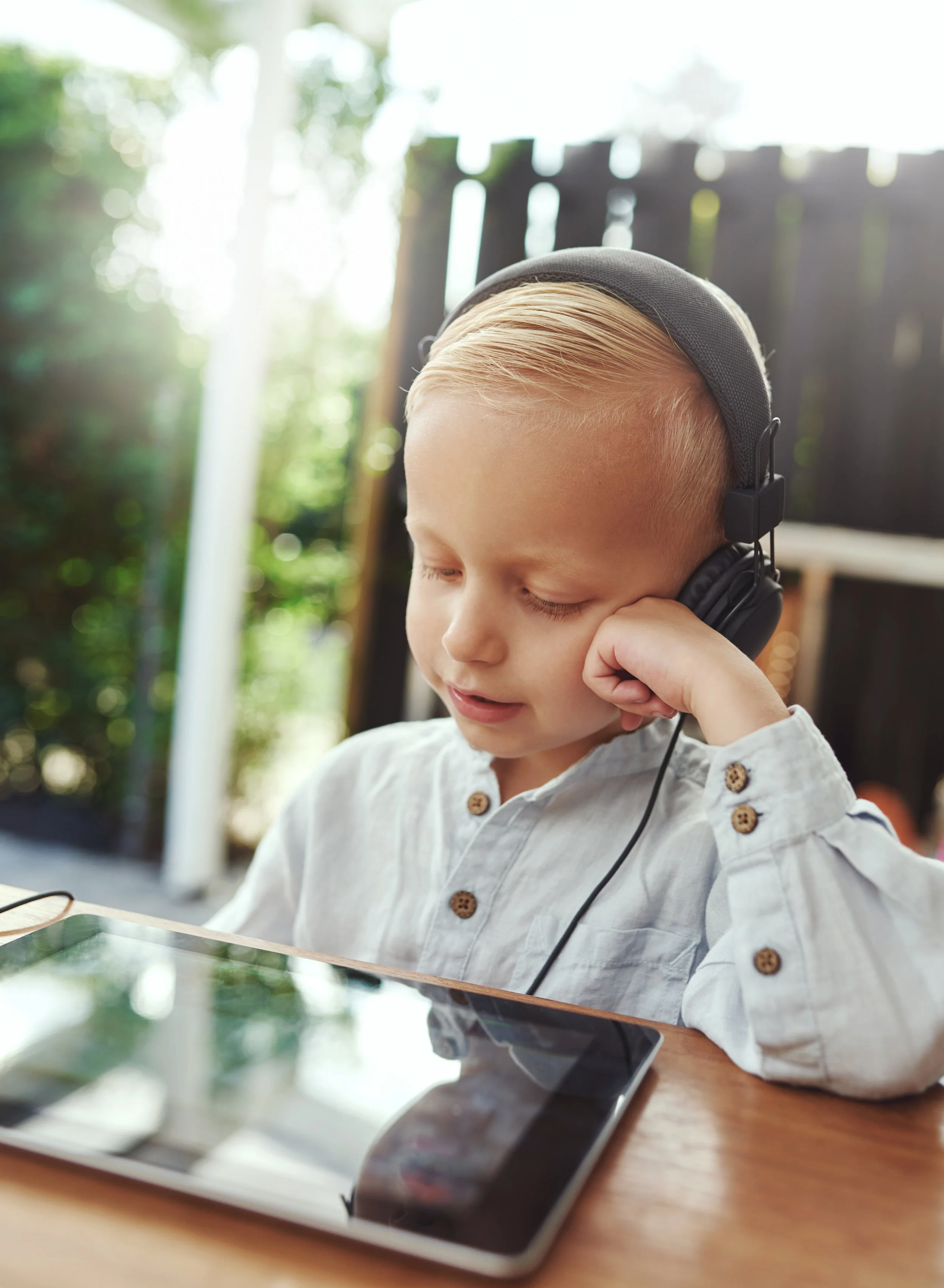 smiling-little-boy-listening-quietly-to-his-music-PMG5L8F.jpg