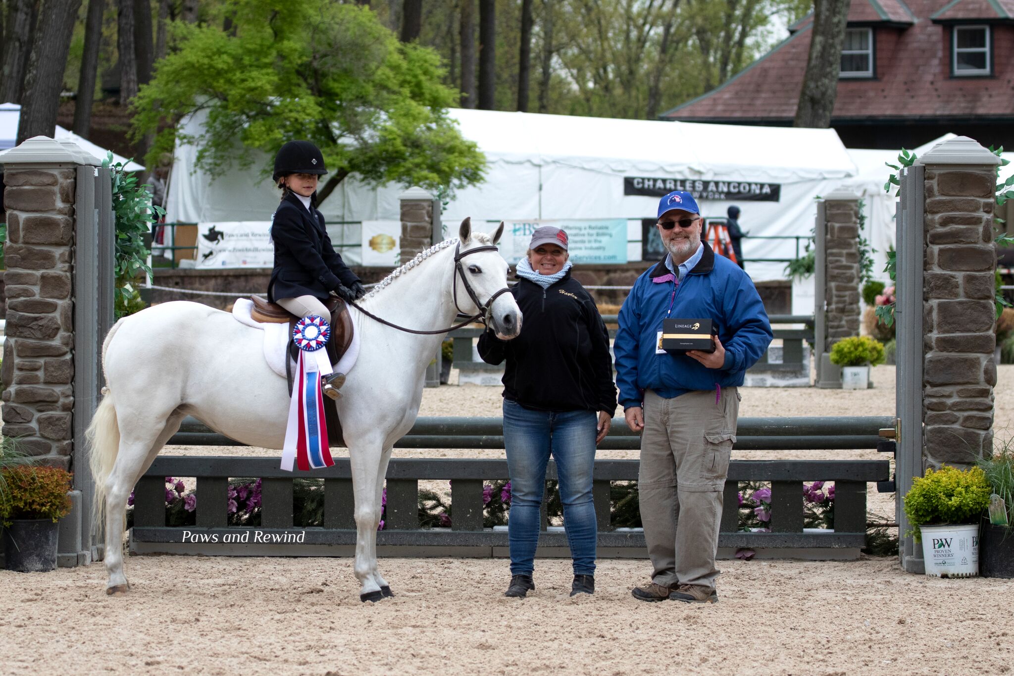 Allan Spina presented the Lineage Equine Sportsmanship award to Kaitlyn Belanus. Photo by Paws and Rewind