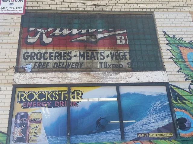 689 Geary. One of my favorite signs in San Francisco, uncovered when a billboard was removed from this corner store. Let's count the signs on this: Rainier Beer sign, Ceramic signs for Tree Tea Ceylon & Oolong and MJB Coffee why, A grocery store with free delivery featuring a telephone exchange number. These numbers were phased out in San Francisco in 1953.