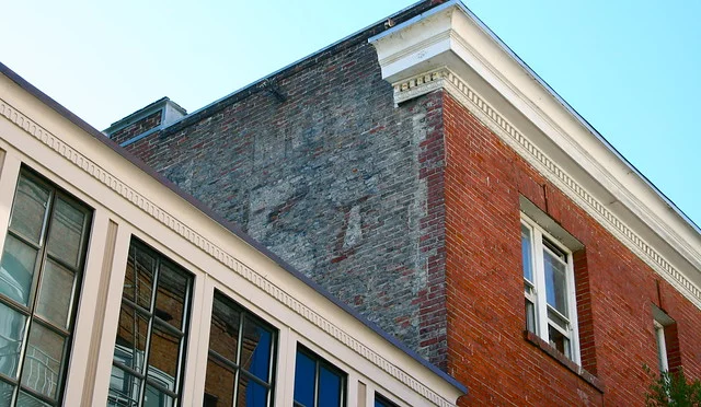 The Owl Cigar sign as seen from Meacham Place