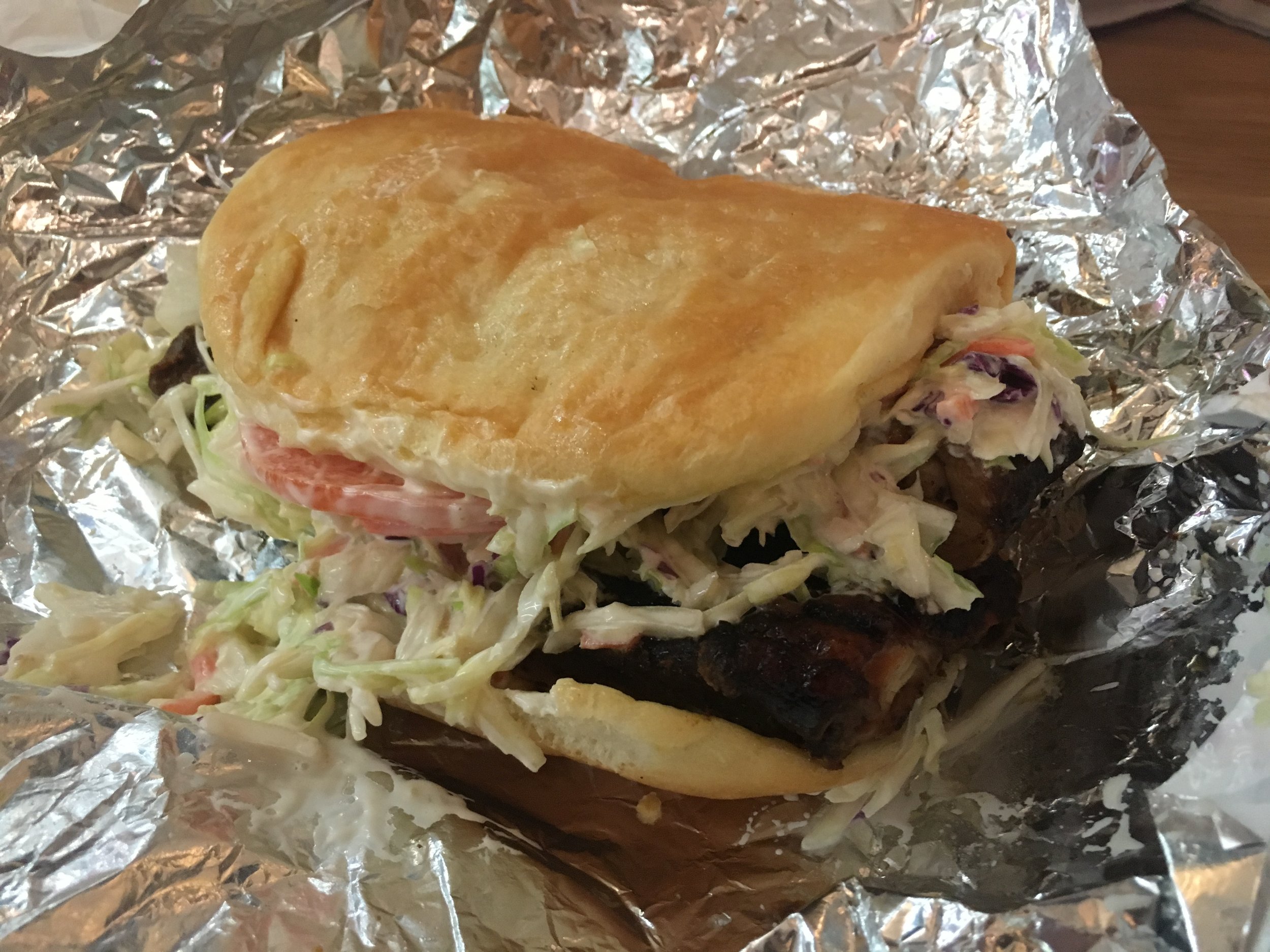 The jerk chicken sandwich ($10) is served on Jamaican coco bread and comes with a beverage. (CanCulture/Severina Chu)