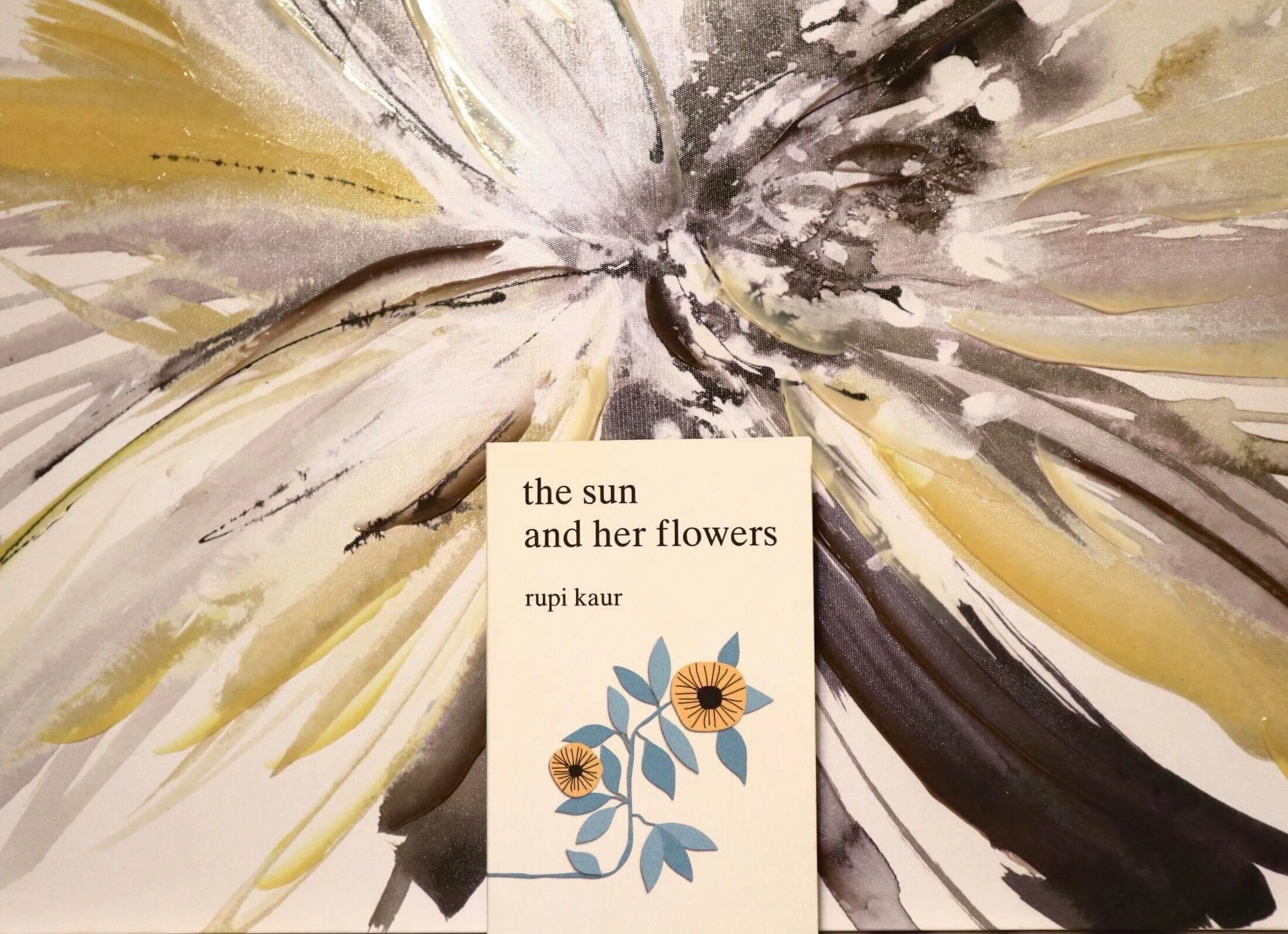 The stark white cover can be seen with illustrations of sunflowers. (CanCulture/Mariah Siddiqui)