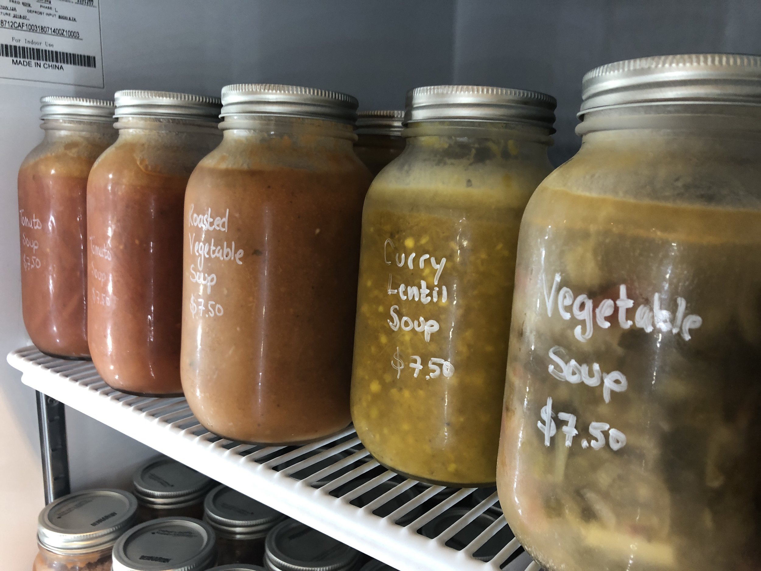 Unboxed Market sells vegetable soups in jars, made in-house from scraps of produce left over from their industrial kitchen underneath the store. (CanCulture/Sophie Chong)