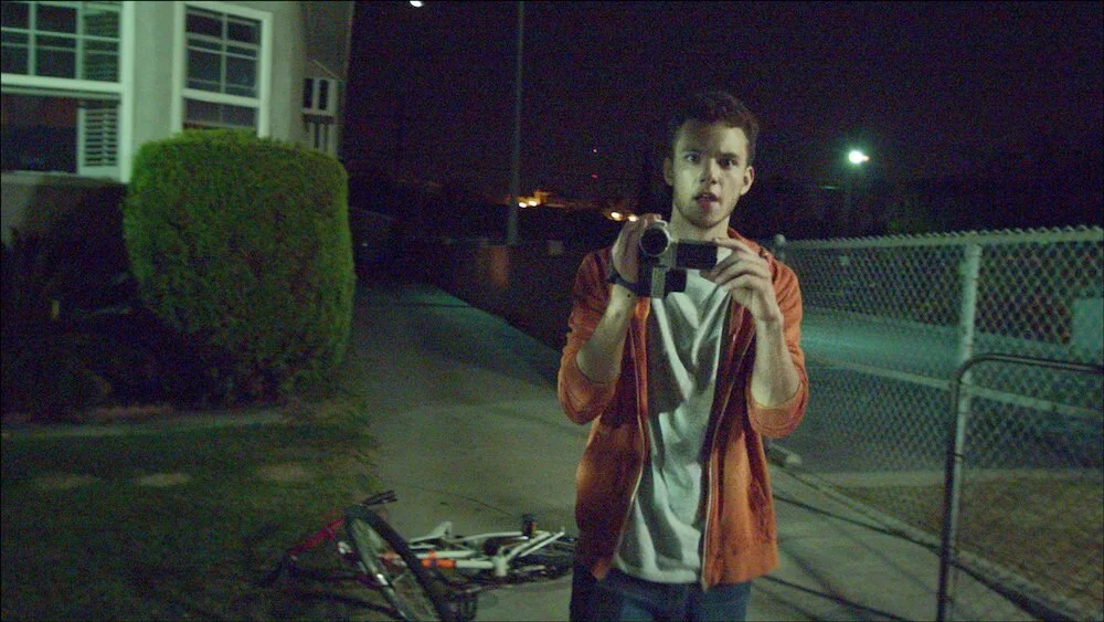Kevin (Patrick Lawrie) practicing his amateur videography in the short film Vicious Circles, a part of the horror anthology V/H/S: Viral (2014).&nbsp; (Photo Courtesy: Magnet Releasing)