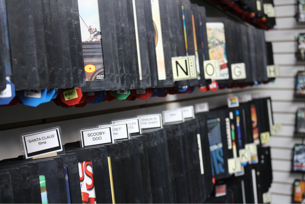  Close up of DVD section names to sort Bay St Video's collection for customers. 