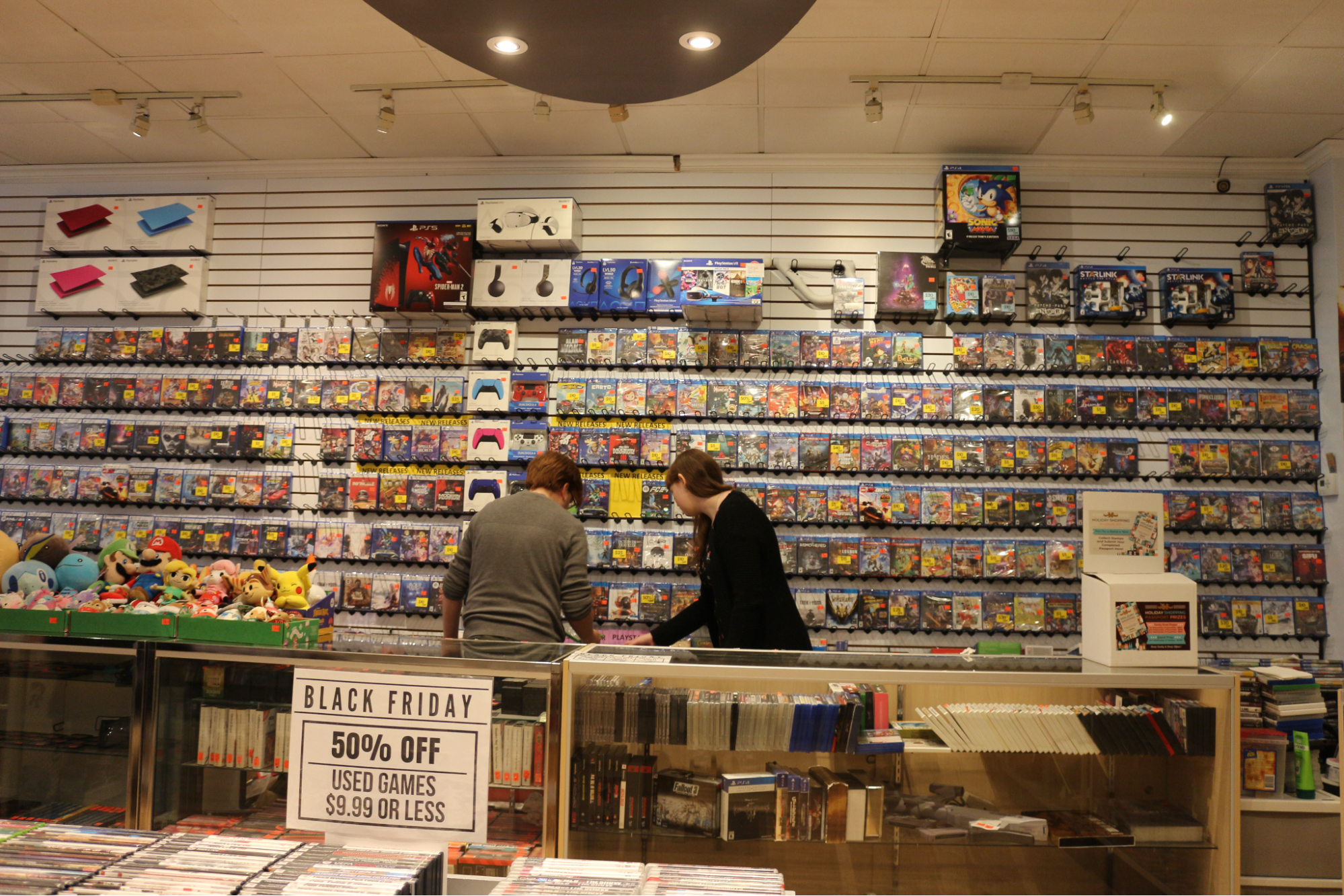  Iceman Video Games workers chat behind the counter in the background. 