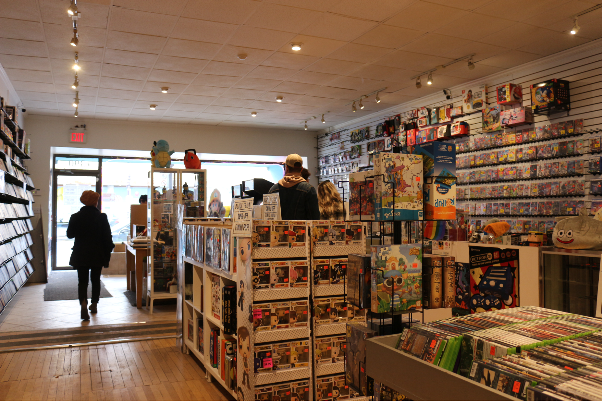  A customer walks around a store among the merchandise. 