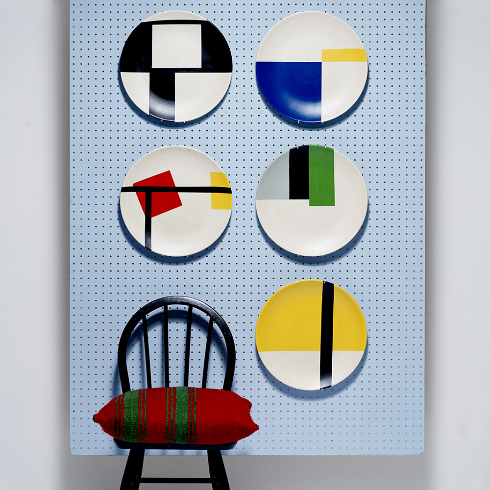Ercol chair with plates.jpg