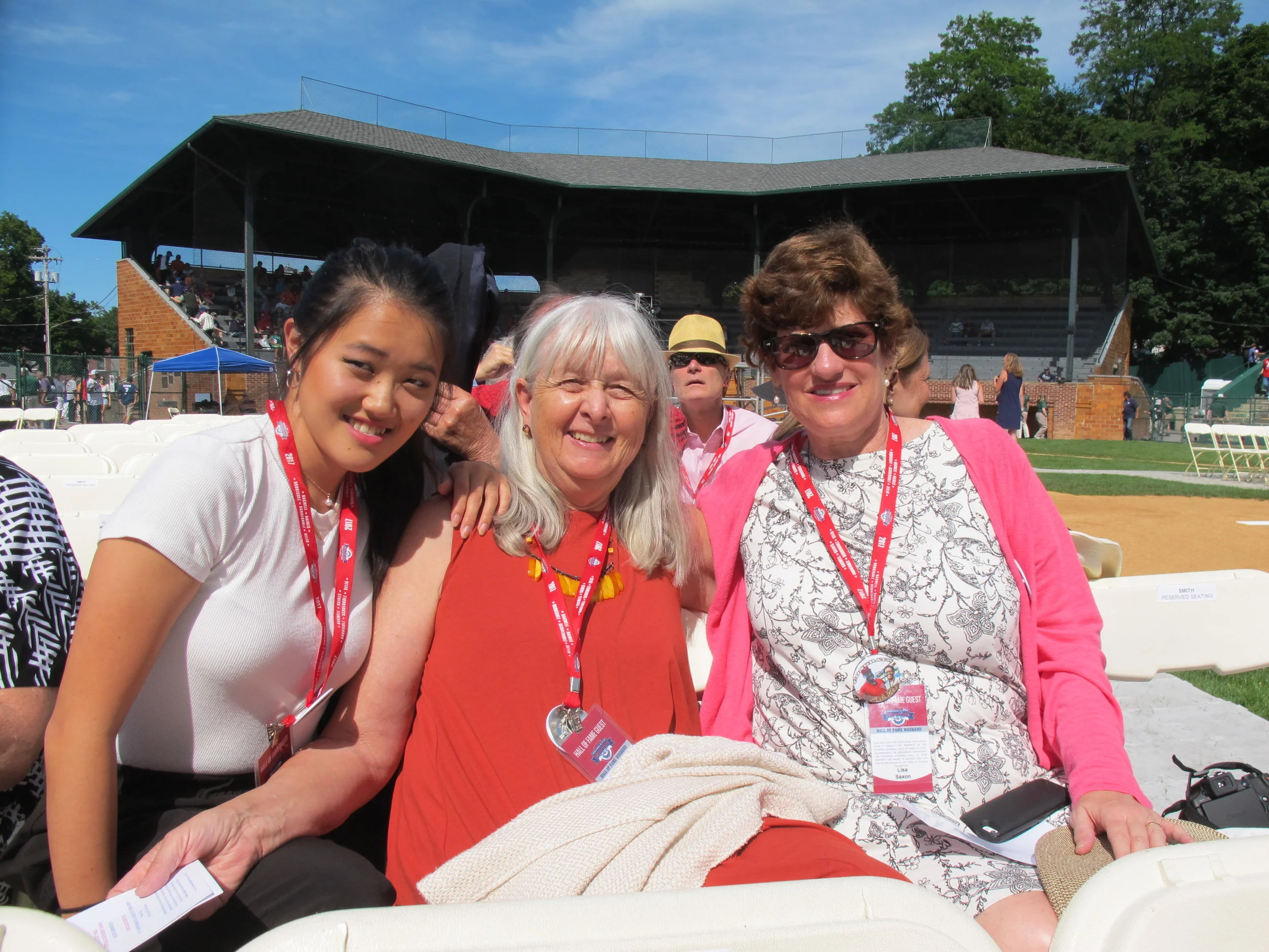Lisa Nehus Saxon, right, Melissa Ludtke, center, Maya Ludtke (Melissa's daughter), left at the Baseball Hall of Fame's baseball diamond for the hall's induction of Claire Smith. July 2018