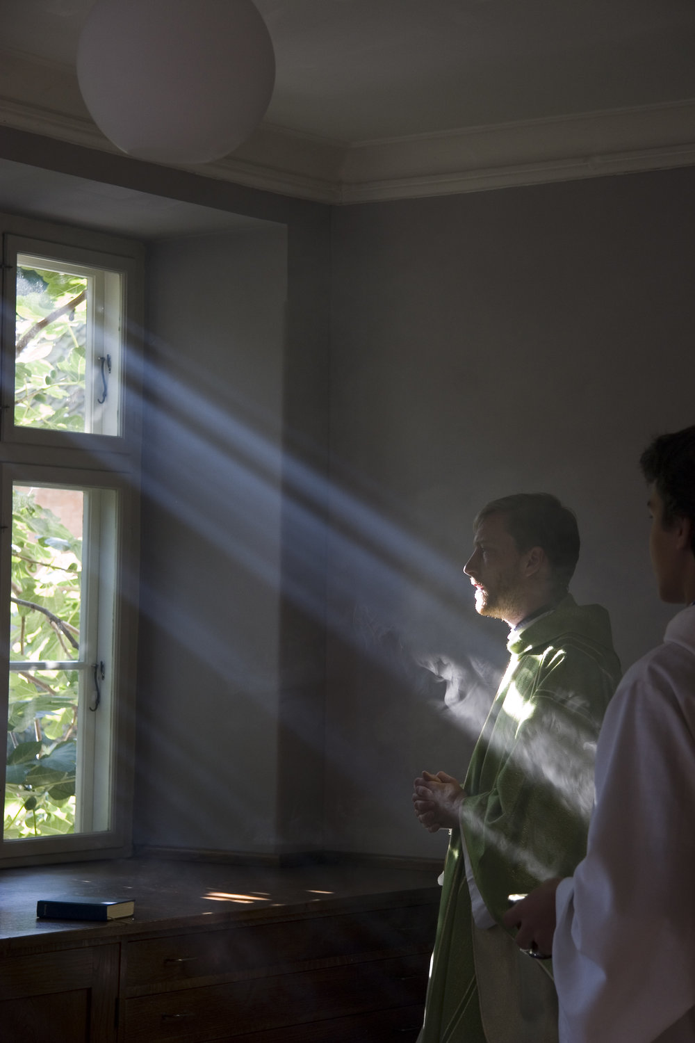  Daniel Nørgaard performs a personal prayer before mass at Sankt Ansgars in Copenhagen, Denmark. 