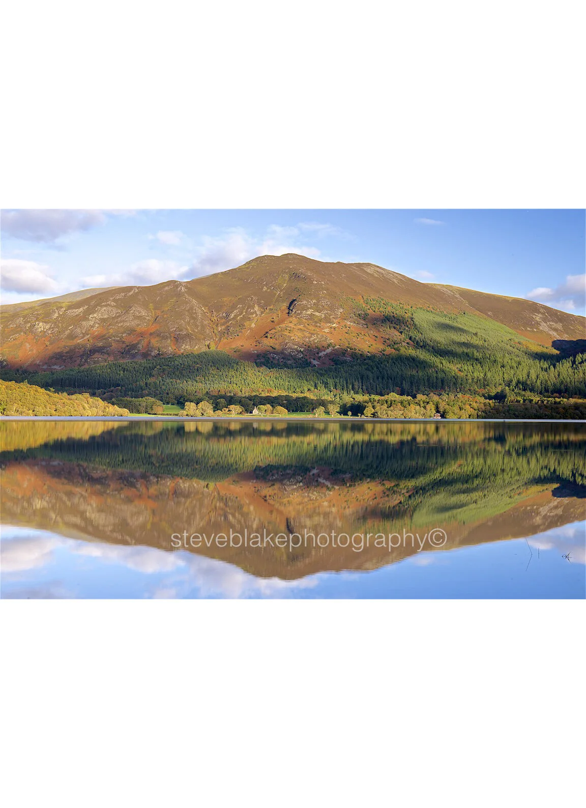 Autumn reflections - Bassenthwaite with St Bega’s Church and Ullock Pike.