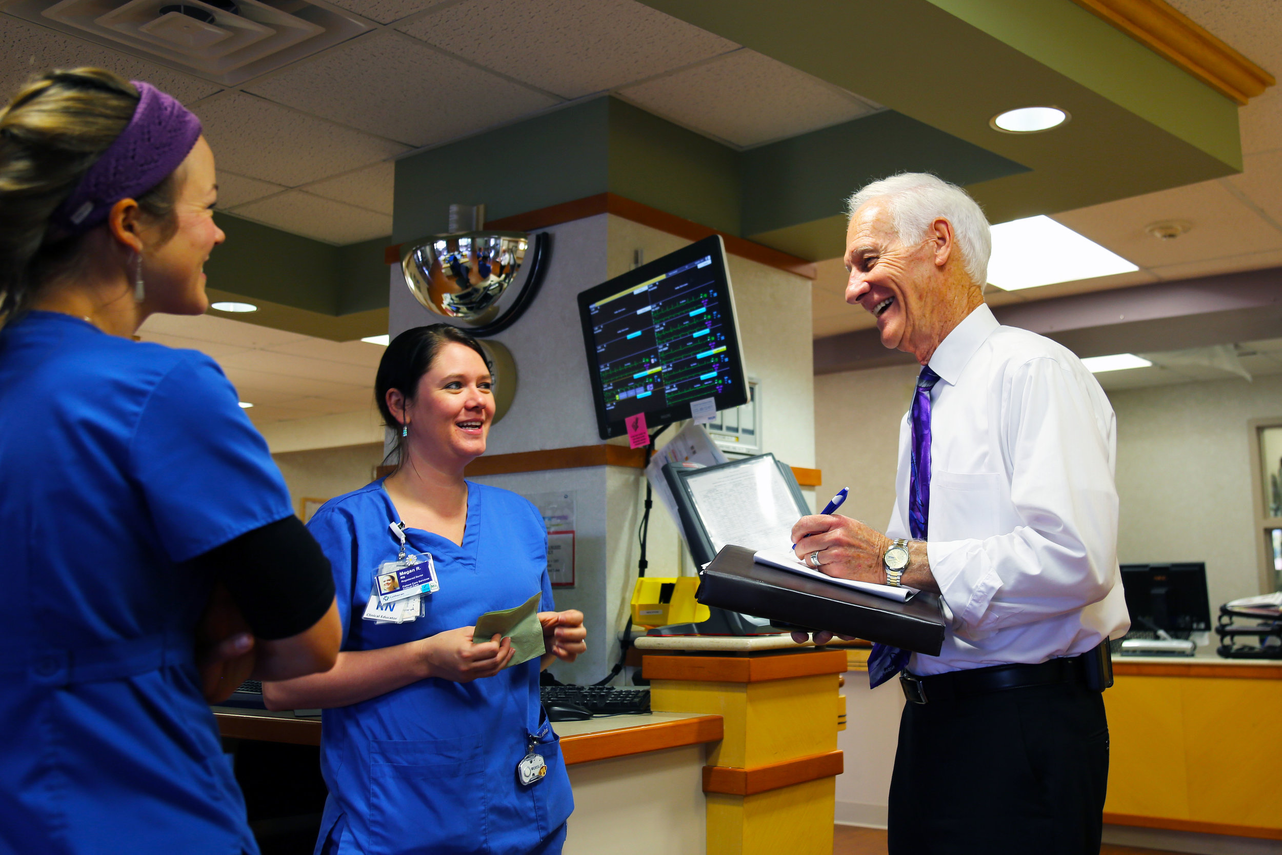 Spiritual care and nursing associates converse at Lutheran Medical Center