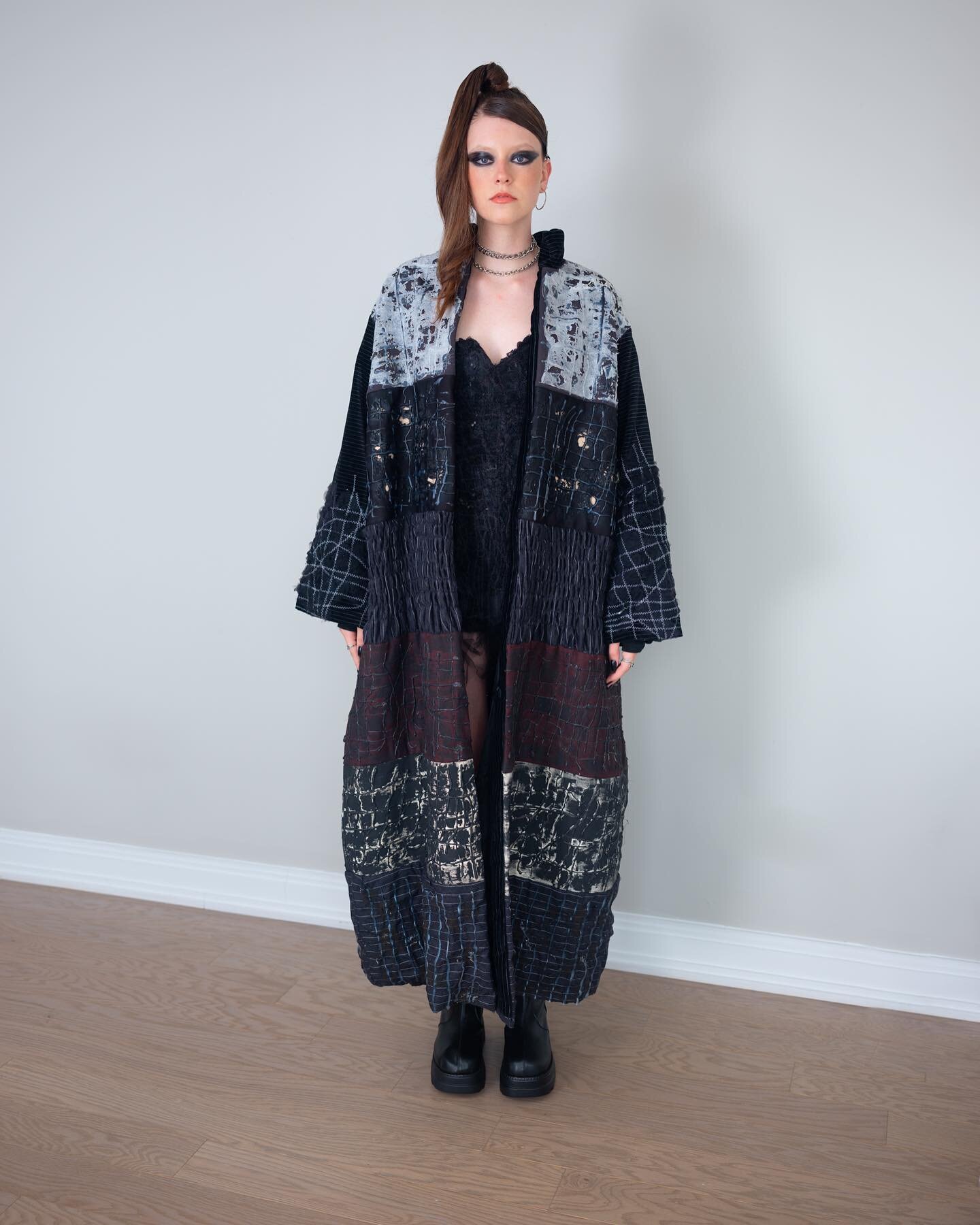 METAMORPHOSIS LOOK ONE : The first look is an oversized coat overtaking the wearer&mdash; how women feel when we are suffocated by what&rsquo;s expected of us. It is also made of textiles distorted and deconstructed using dryer sheets, a hot glue gun