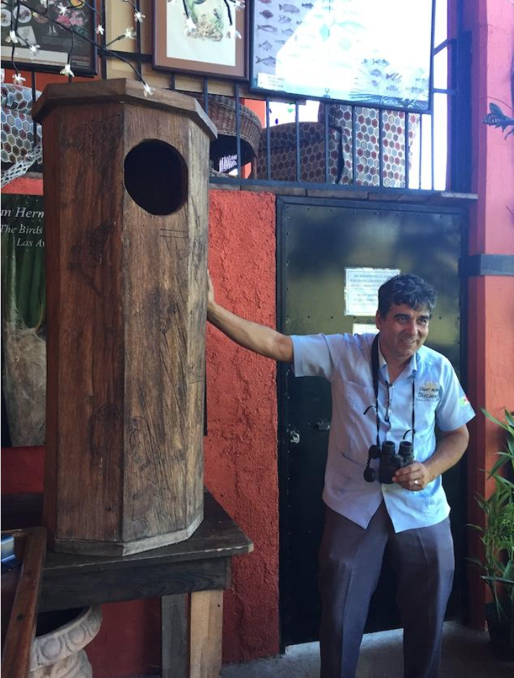 Jorge Novoa and his wooden Guacamaya nest on display at the Vallarta Botanical Garden