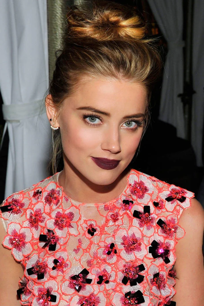 harpersbazaar:

Today’s Beauty Secret: Dark Lips and A Messy Bun
Photo Credit: Getty Images