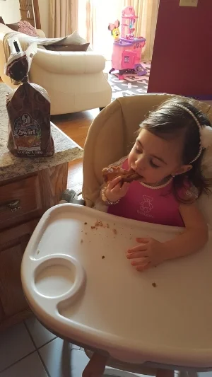 My daughter thoroughly enjoying some Aunt Millie's Swirl Bread