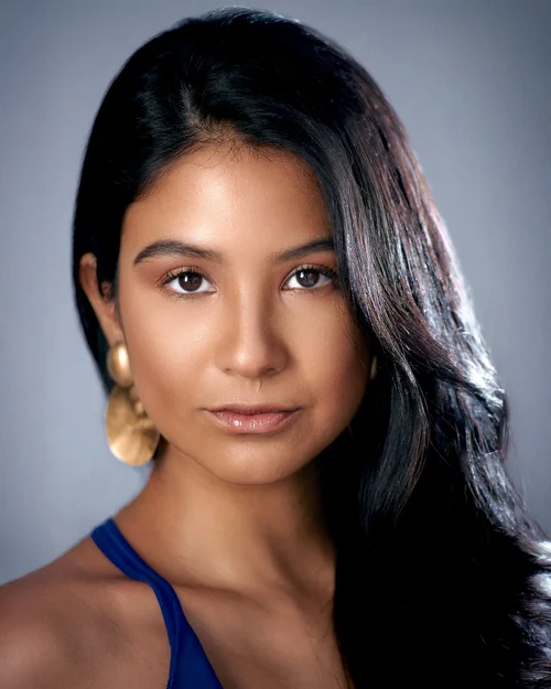 Studio headshot on grey