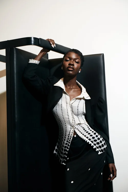 Guided editorial pose with chair
