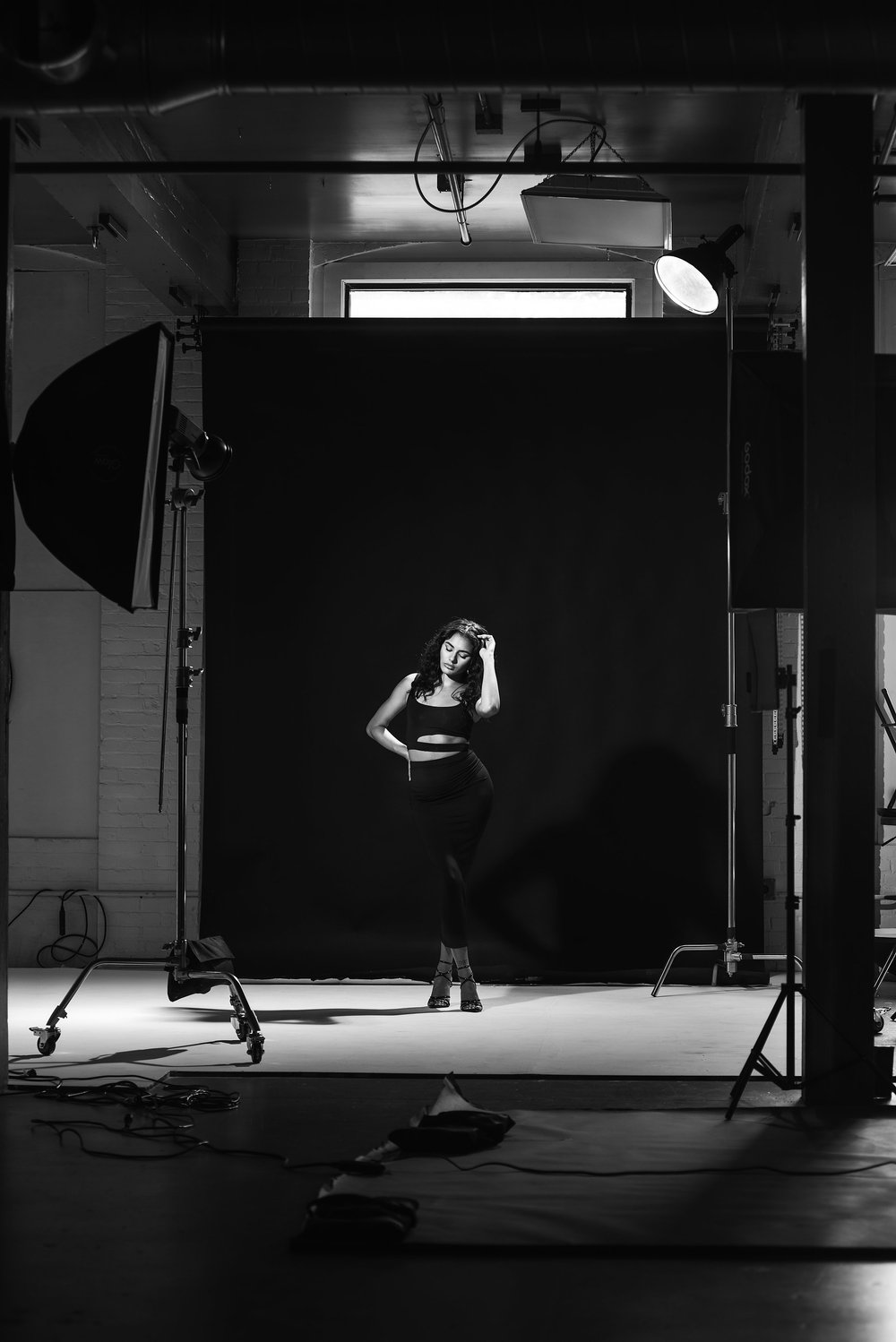 Model posing on set in the MDuran Studio, lit with a softbox