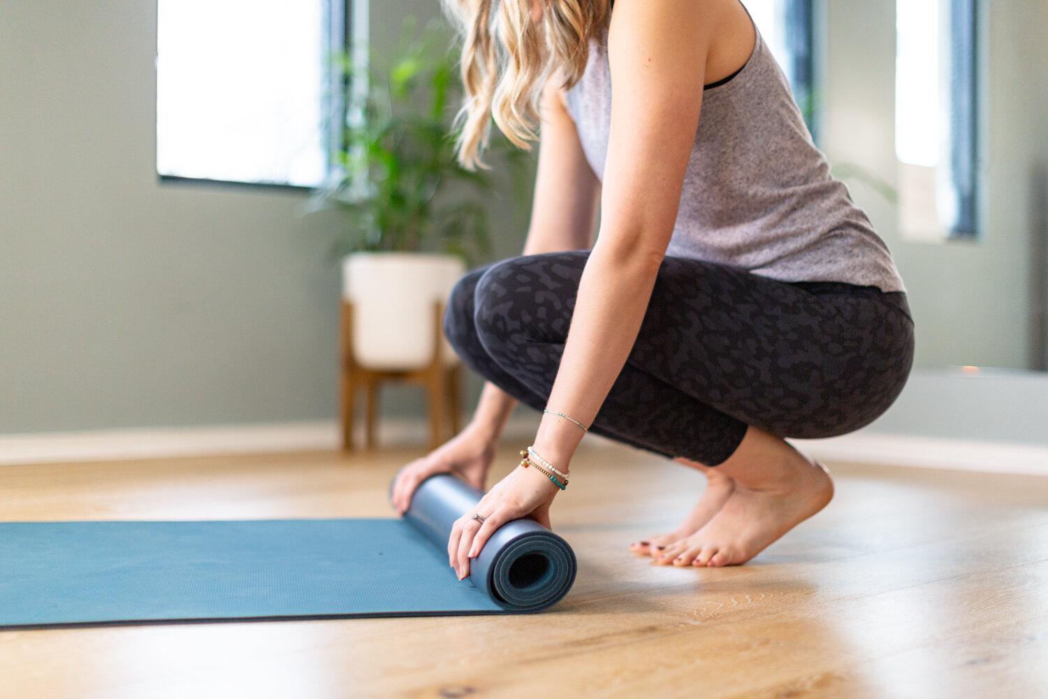 The pilates vibe online, rolling a pilates mat